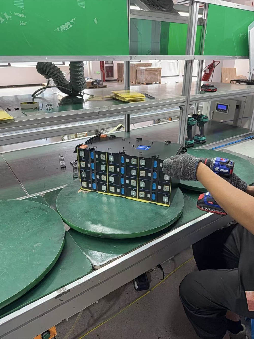 Battery pack assembly work in progress at Minglong factory