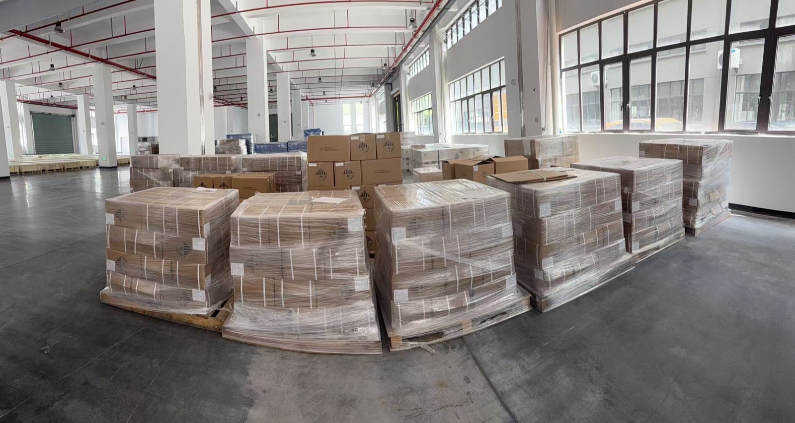 Packaged cartons on pallets in the Minglong factory warehouse